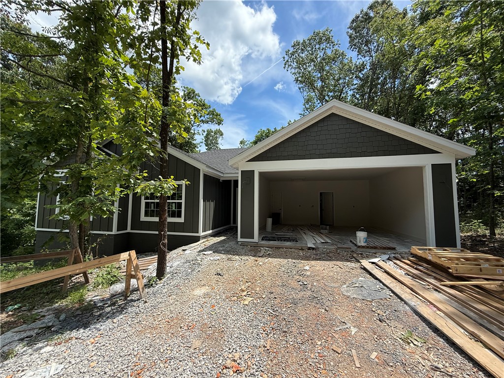Welcome to your dream home nestled in the gorgeous Bella Vista! This brand new construction offers the perfect blend of modern design, functional space, and peaceful natural beauty ā all on a relatively flat lot & within walking distance of Branchwood Club! Step inside to find a spacious open-concept living room, perfect for relaxing or entertaining. The heart of the home features quartz countertops, a pantry with ample storage, and a large mudroom that keeps daily life organized and clutter-free. Retreat to the primary suite, where youāll find custom board and batten walls, a walk-in shower, a luxurious soaker tub, and a layout designed for comfort. The guest bedrooms are generously sized and served by a spacious guest bathroom, making this home ideal for family and visitors alike. Enjoy thoughtful touches, like custom trim work, modern finishes, and a back deck perfect for morning coffee or evening relaxation. This Bella Vista beauty checks all the boxes!