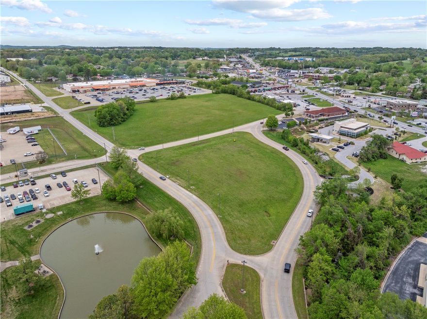 Prime commercial opportunity in one of Harrison’s busiest corridors! This versatile lot is ideally located near major retailers like FedEx and Home Depot, offering exceptional visibility and accessibility. It features road access on three sides, the property is perfectly suited for a variety of business uses—retail, office, restaurant, or service-oriented ventures. Don’t miss your chance to invest in a high-traffic area with strong growth potential!