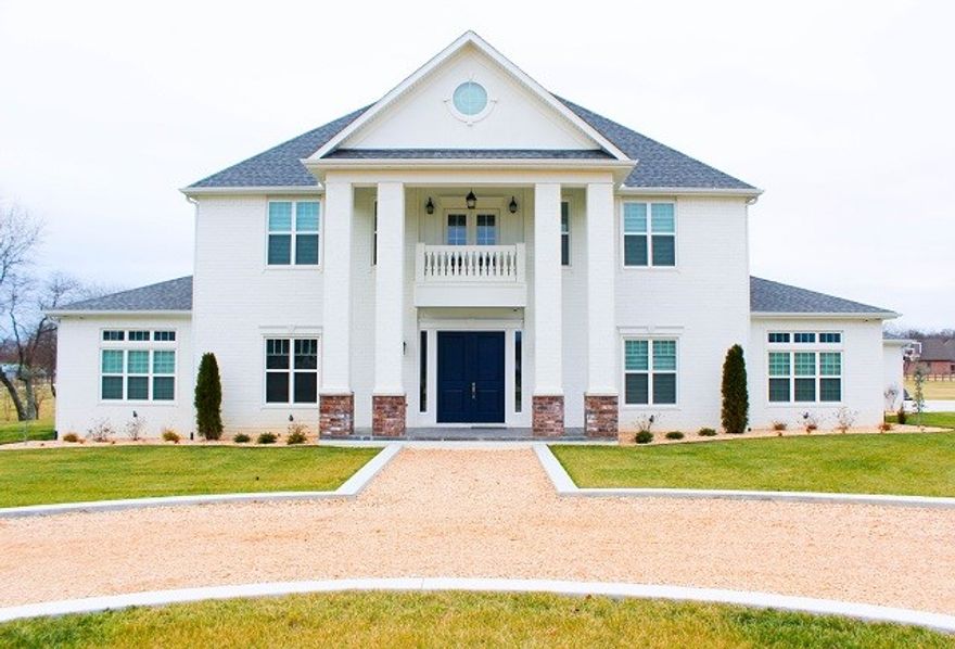 Beautiful plantation style custom home in a dream location. The property is located just west of Scissortail. Enjoy the rich area yet have room to breathe with over 6 beautiful acres. The interior has a modern, crisp design that melds with traditional features. This is a must see home!
The kitchen features high end professional grade appliances,built in refrigerator,