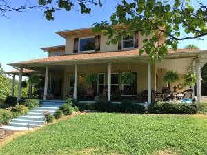 This wonderful country home just minutes from town has been updated with a large luxury office. Built in 2004 and sitting on 10 acres, this home has all the extras. Spacious kitchen with large pantry, beautiful cabinets, 2 sinks, island, breakfast bar and baker's pantry. 4 bedrooms, 3 1/2 baths featuring a large master suite with walk-in closets with built-ins, jacuzzi tub & separate double headed shower. Wrap around porch & deck. Pasture and woods with year round creek running the length of property.