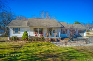 Looking for that Country Living feel yet close to town? Home sits beautifully on a Large corner lot! For your outdoor living space, you'll enjoy the 20x28 deck, outbuildings, green house and large garden.. Do you Love Blackberries? Mature Thornless blackberry bushes produce over 50 gallons of berries a year plus A strawberry bed and 9 Blueberry bushes! The large deck and brick patio with inviting fire pit nestled between maple trees awaits your Friends and Family gatherings. That's the outside, NOW for the inside! 4 Bedrooms, 2 Bath, open concept with split bedroom floor plan. (Spacious 4th BR could be a mother in law suite) The vaulted ceilings, flooring and paint color just welcomes you right in! Great subdivision, lovely neighbors and close to town. Call to see it today