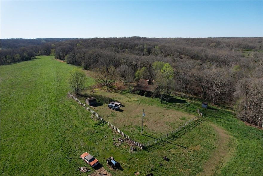 Don't miss out on this great opportunity! Excellent development potential on this amazing 98 +/- acre property with highway 102 frontage. Conveniently located just 16 minutes to Walton Blvd or NWA Regional Airport. Electric on site with 3-phase electric and two ton public water at street, existing home has well and septic on site. Value is in the land and location, existing home is in need of multiple repairs.
