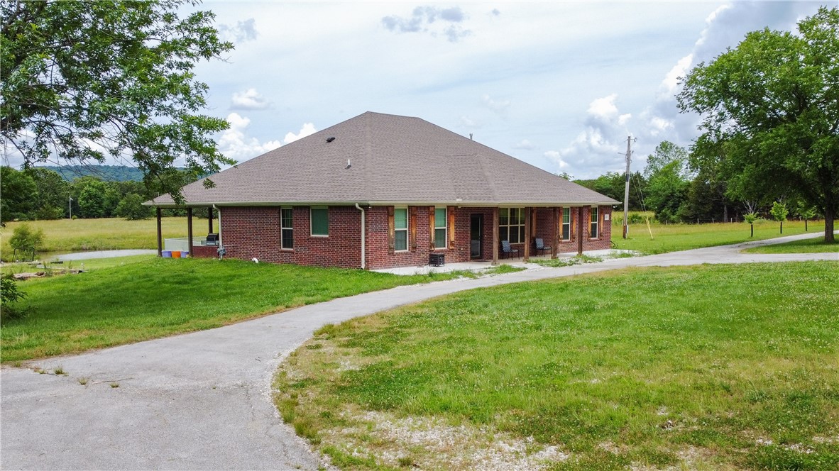 Well maintained home on 14 acres with two large shop buildings. One is 50X60 insulated with lights, heaters, fans, office space and an auto lift. The other is 30X50 bare with lights. This home has the country setting while still being a couple minutes to town.