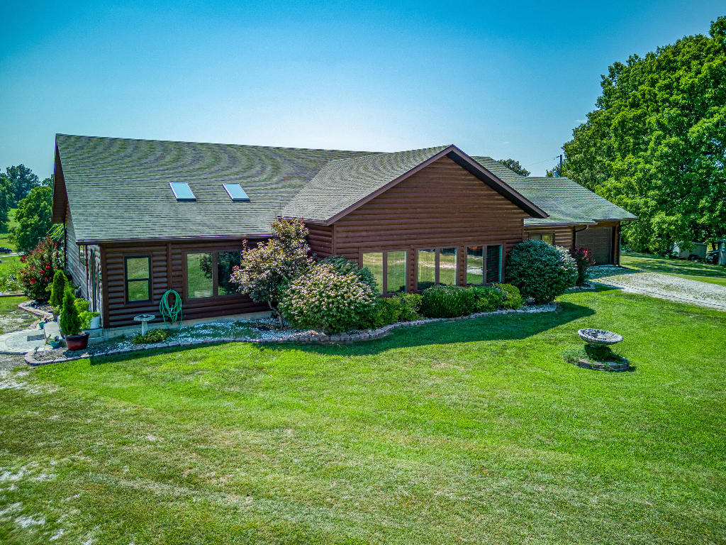 Stunning, Simply Stunning! Looking for a home on 10 acres that is peaceful, with an amazing view and an open floor pla.....and is close to town? Check out this 3 BR/2 1/2 BA with large back deck overlooking a beautiful view. Vaulted ceilings, floor to ceiling windows lets in the natural light. Above ground pool remains at the home. From the Sunroom to the large bedrooms and open concept,this home has it all. Even has a storm shelter! 2 car garage, LARGE Master bedroom opens to the sunroom to enjoy that morning cup of coffee while you take in that peaceful view. Kitchen has a unique granite island unlike any other! Come see this home today! You will not be disappointed!