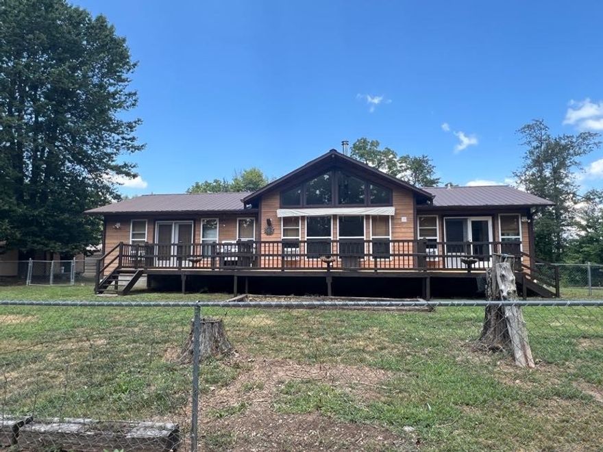 This 2 bedroom, 2 bathroom self sustainable home perfectly situated on 35 acres that borders Ozark National Forest Land on the south side in the heart of Jasper, Arkansas. Tucked away in a quiet and peaceful setting, this property offers unmatched privacy surrounded by beautiful hardwood trees and abundant wildlife. The home is connected to the electric grid for convenience, yet thoughtfully equipped with a backup solar power system for energy independence. A rainwater catchment system with 5000 gallons of storage ensures a sustainable water source year-round. Make use of the existing gardens, chicken house, and be within steps of the National Forest for hunting. 

Enjoy the best of both worlds—modern comforts in a secluded, nature-filled location on a dead end road. Whether you’re looking for a permanent residence, a weekend getaway, or a self-sufficient homestead, this property delivers peace, beauty, and practicality.