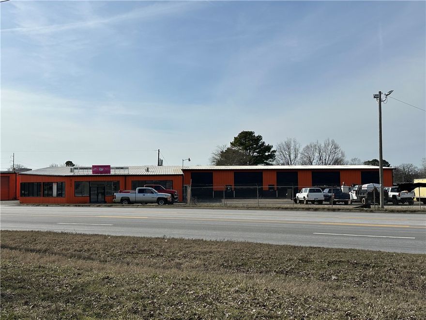 Warehouse-Service Center-Showroom-Office with Fenced Yard and 2 points of truck access from NE Hudson (Hwy 62). Currently available: Two buildings: A 17,000 sq ft main warehouse/office building + a 2400 sq ft outbuilding warehouse on 2.90 acre site. All utilities available to site. Superior location with combination of flexible building configurations and large yard area make this a very unique and desirable opportunity. SEE MARKETING FLYER, SURVEY AND FLOOR PLAN ATTACHED. The property is also available for lease. Call broker for more information.
City of Rogers Zoning T5.2 Commercial designation allows for permitted commercial uses including auto service, entertainment / event venue, retail sales, food / beverage and professional services. Permitted residential uses include apartment house, mixed-use and townhouse developments. Other commercial uses may be allowed. Buyer prospects should verify directly with City of Rogers Planning department prior to submitting any offer to purchase.