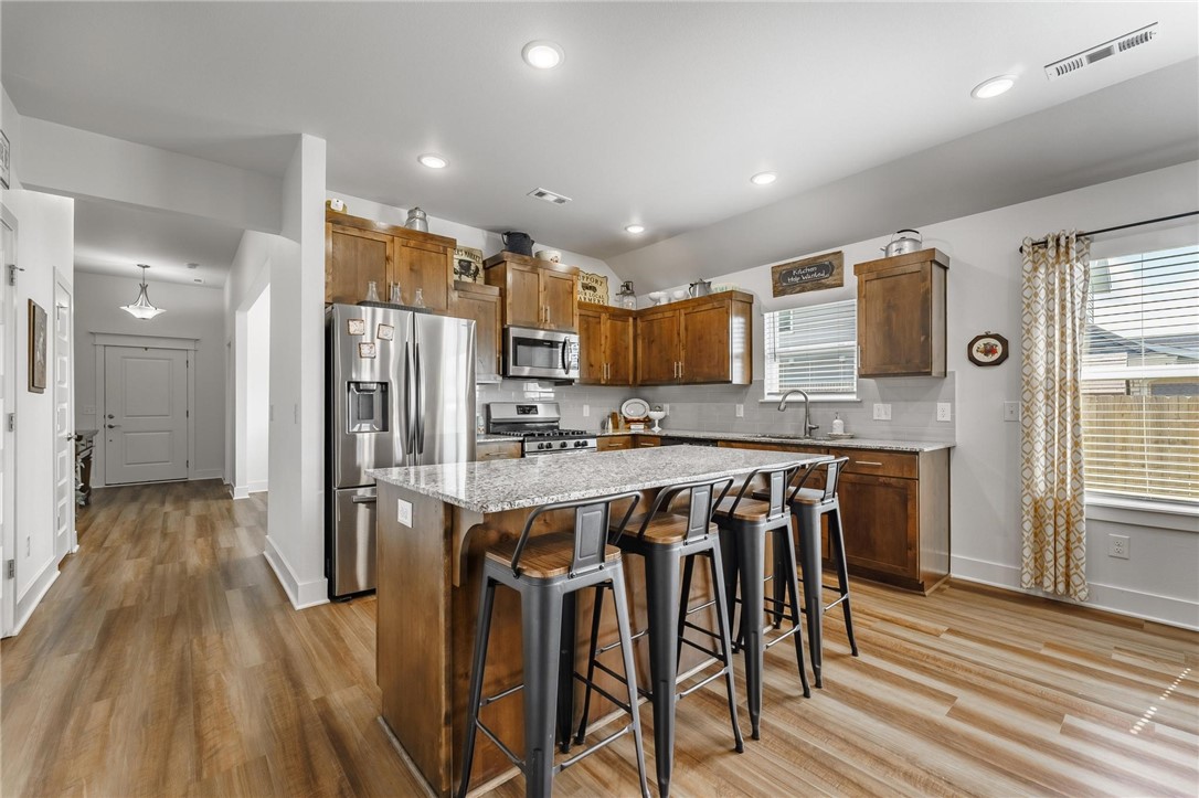 Beautiful like new home in Snyder Grove..Enjoy the open, light and bright living room with gas fireplace boasting shiplap accents above. One story home with eat-in kitchen overlooking backyard & covered patio. Kitchen has tons of counter space with large island, granite, gas range, cabinets with storage and pantry. Open concept that's perfect for entertaining. Spacious master bedroom with large master bathroom with beautiful custom barn door slider. Master bath has walk-in shower, tub and walk-in closet. Perfect space to entertain with a formal dining room. Great backyard on a nice flat lot! Large 3 car garage. Perfect location with easy access to Delford Rieff Park, Prairie Grove Aquatic Park and Highway 62.