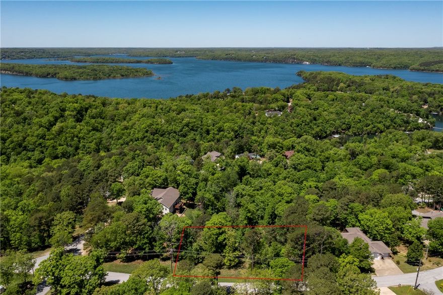 Buildable .44-acre lot in the scenic Beaver Lake area.  Located in a developed neighborhood with established homes.  Gently sloped terrain offering flexibility for custom home design. 
Minutes from Beaver Lake recreation! Just 2 miles to the Highway 12 boat ramp
Conveniently located: 8 miles to Downtown Rogers, 17 miles to Eureka Springs – perfect for weekend getaways and dinner.
Close to hiking, boating, fishing, and nature preserves.  A rare opportunity to build your dream home or vacation retreat in a peaceful setting.
Ideal for those seeking lake life with city access nearby.