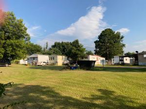 INVESTORS OPPORTUNITY!!!! Check out this 9 unit Mobile Home park located inside the Clarksville City Limits!! This park sits on 1.20 acres. Seller does not own these mobiles, they are owned by the tenants who pay a monthly rental fee and are responsible for their own electric and water. Seller pays for trash and lawn maintenance. This park has a well maintained driveway that is just right off of Hwy 64.