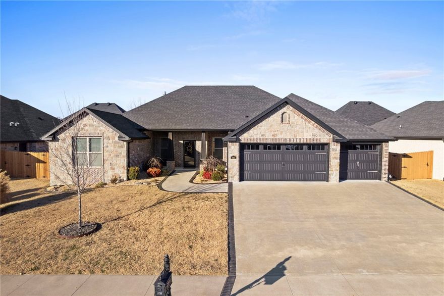This is the home you've been waiting for! Built by Cornerstone Construction, perfectly situated within walking distance to Bentonville West High School and Centerton Gamble Elementary. This 4 BR, 2.5-bath home offers high-end details and amenities designed to impress. The focal point of the living area is a striking fireplace, complemented by a chef's kitchen that boasts an oversized hidden pantry, offering ample storage and workspace. Beautiful hardwood floors flow throughout the entire home all on one level.  Step outside to a fully landscaped yard, effortlessly maintained by a built-in sprinkler system. Additional features include a central vacuum system, wireless security, surround sound wiring, cellulose insulation, and more. Above ground tornado shelter conveys and is situated in the 3 car garage for peace of mind.  This home won't last long! Schedule your showing today!