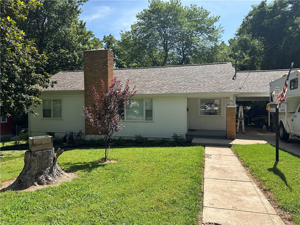 Charming property is within walking distance to downtown and the new Creekside Community Center - ideal for the first time home buyer, rehabbers or investor. Home is situated on a tree-shaded lot with maturing trees offering both privacy and curb appeal. Newer roof, manicured exterior include vinyl siding, drive way with an attached car port. Offers 2 bedrooms and 2 bathrooms that have been upgraded. Ceiling fans, hardwood floors, attic access with fireplace. This home is the country charmer of Cherry Street.