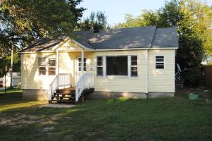 Cute, cottage-style house - recently updated with new laminate flooring and interior paint. Large front yard and deck. This is a must see!