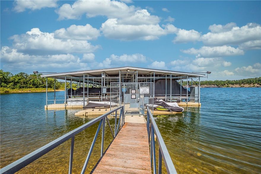 Turn key and maintenance free lake living!  This upscale 1,976 sq ft lake-front condo is situated on the terrace level of a well-established community, offering complete privacy. Expertly renovated by HOWSE, the fully furnished 3-bedroom, 2-full bathroom residence is designed to satisfy even the most discerning buyer. All main rooms open onto a wide, continuous terrace that overlooks a tranquil cove of Beaver Lake. Offering direct lake access, a private boat slip with a new lift and automated boat cover, this home offers all the luxuries of lake living. Accommodations include, a club house, indoor heated pool, gym, recreation|game room, outdoor entertaining areas, tennis, pickle ball, and basketball courts.