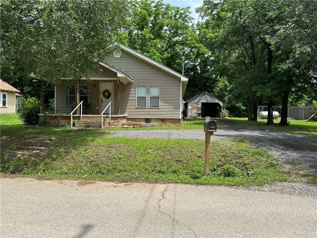 This recently renovated 3-bedroom, 2-bath home is located within the city limits of Marshall, Arkansas. Offering approximately 1,245 square feet of living space on a surveyed 0.16-acre lot, the home features central heating and cooling, a cozy fireplace insert, a dedicated laundry room, and a durable metal roof with low-maintenance vinyl siding. With its updated interior and convenient in-town location, this move-in ready property is ideal for comfortable everyday living or as an investment opportunity.