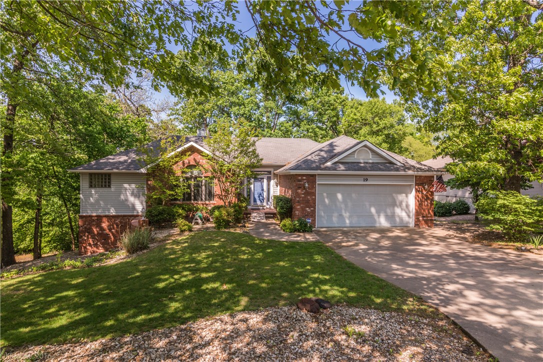 The spacious home features an open living room as well as a large family room, one with gas log fireplace and the other with a wood burning fireplace, an all seasons sunroom overlooking mature trees, a large deck with accessible stairs from the lower level and patio, balcony. Large Master Bedroom/Bathroom with amenities. Hvac was recently upgraded in 2015. This is a must see!