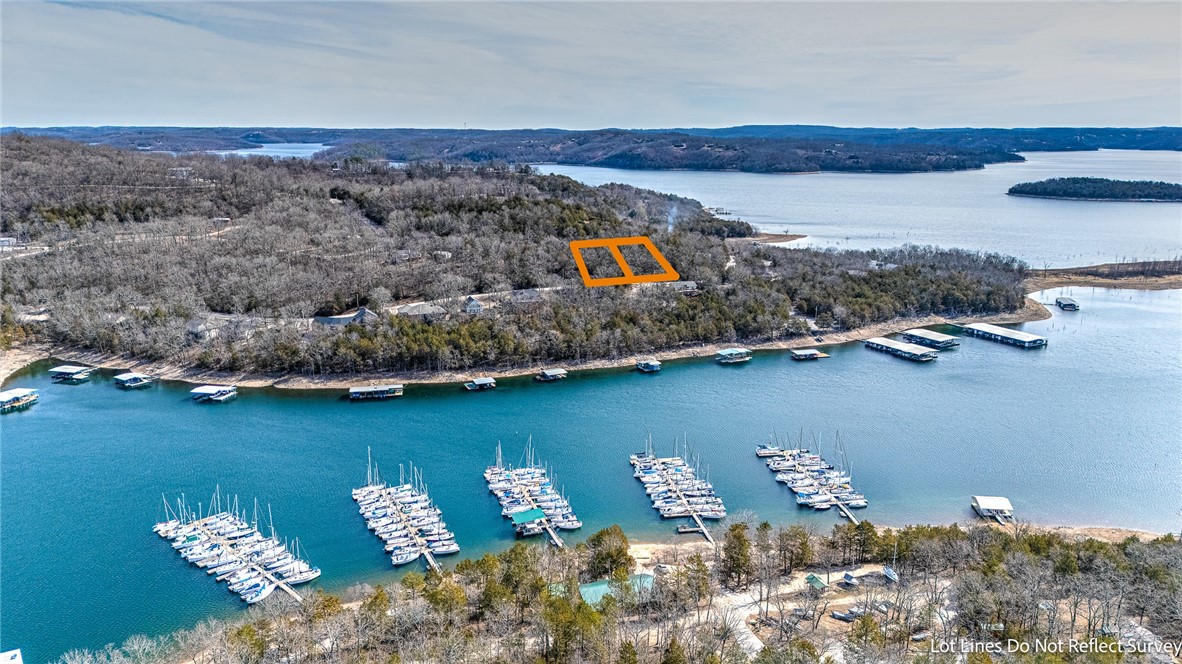 Welcome to your slice of paradise in the heart of Lost Bridge Village! Envision your dream home built upon this exceptional 0.62-acre double lot, blending natural beauty with a view! Just across from the tranquil waters of Sailboat Cove on Beaver Lake, youāll enjoy breathtaking lake views and easy access to boating, fishing, and all your favorite water activitiesāplus a boat ramp just steps away.With public water & sewer already in place, youāll save on construction costs, making this the ideal spot to build your dream home. The lot itself is partially wooded with a gentle slope, featuring a stunning rock ledge along the back that adds both privacy and an opportunity for creative landscaping. It also boasts a spacious flat area perfect for building, in the middle of the property.This is located in one of the areaās most sought-after lake neighborhoods, offering endless potential for a lakeside retreat or year-round living. Donāt miss your chance to turn this serene setting into the perfect lakeside sanctuary!