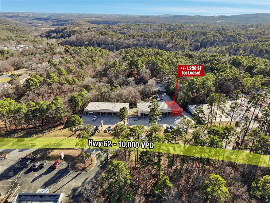Position your business for success at this prime retail location on busy Highway 62, one of Eureka Springs' main traffic corridors with approx. 10,000 VPD. Located in a thriving strip center, Holiday Plaza, with complementary neighboring businesses, this flexible +/- 1,250 SF space features an open retail layout, convenient storage closet, ample free parking, and multiple signage opportunities, including above suite signage and monument signage for maximum visibility. Whether you're launching a new venture or expanding an existing one, this space is designed to help your business stand out and grow. This property sits in the heart of Eureka Springs' business district, offering excellent exposure and steady foot and vehicle traffic. Offered on a NNN lease structure, tenant pays $100/mo NNN plus electric, internet, and phone in their name. Landlord covers water/sewer and lawn care. Don't miss this opportunity to establish your business in one of Eureka Springs' most sought after commercial corridors.
