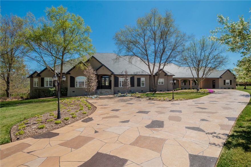 Located on 2.02 acres in the private & highly desirable gated Beau Chene Farms, this 1 level meticulously constructed home has been completely updated with the highest quality & was designed as a welcoming, peaceful retreat. Large foyer opens to a formal living & dining room & library complete with coffered ceiling & wine bar. Impressive gourmet kitchen with center island, high-end appliances & breakfast area overlooking the fireside living room leading to the screened porch & covered patio complete with grill, fireplace, & TV area. Home features a lavish primary suite with resort-like spa bathroom & 3 additional large en-suite bedrooms/baths. Sweeping patios overlook a masterful example of privacy & landscape design. Professional landscaping surrounds the exterior of the home, accenting the covered porches & patios. Garden steps lead down from this serene setting to a fully fenced pool with fountain, diving rock, pool bathroom & private wooded views- minutes from shopping, restaurants, trails, the AMP I-49 & more.