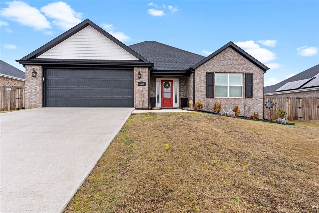 Just listed! This fully upgraded 3 bedroom 2 baths has all the upgrades you could possibly want. Interior features stone fireplace with wood mantel that carries all the way up to the ceiling, plantation shutters throughout, farmhouse sink, upgraded lighting throughout, includes top of the line refrigerator, heavy shower glass door, custom mirrors in the bathrooms, crown molding in the living area, wood beams in both the living area and master bedroom with vaulted ceilings, LVP throughout entire home, google smart thermostat, low flow toilets, and so much more. Exterior features extended concrete patio with pergola, a greenhouse, and 22 raised garden bed boxes. Solar panels are fully paid for and will transfer to the new owners. Located with-in walking distance to the C.L. 'Charlie and Willie' George Park that consists of walking trails, dog park, splash pad, ball fields, and tennis courts. Easy access to the Don Tyson Pkwy. Schedule your showing asap on this beauty!