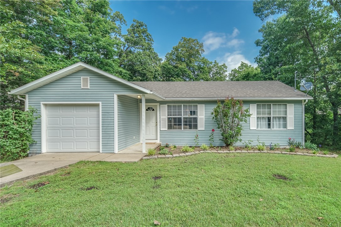 First time home buyers or investors will not want to miss this super cute home. Great location in south Bella Vista and close to Hiway 71. New "11 Under" Bike Trail is steps away. Refrigerator and Washer/Dryer convey with home! Fenced yard is great for kids and pets. Wonderful layout with kitchen/eat-in dining area leading into vaulted ceiling in living room that give this home an open and airy feel. Enjoy the view from newer wood deck. Quiet neighborhood with homes on only one side of the street. This home will not be on the market long. Make your showing appointment today!