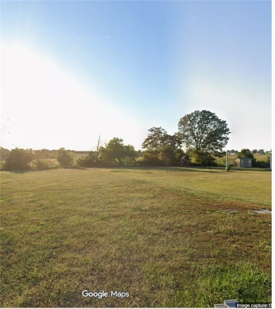 Level half acre lot with utilities in place, manufactured homes allowed, and on a paved street.
