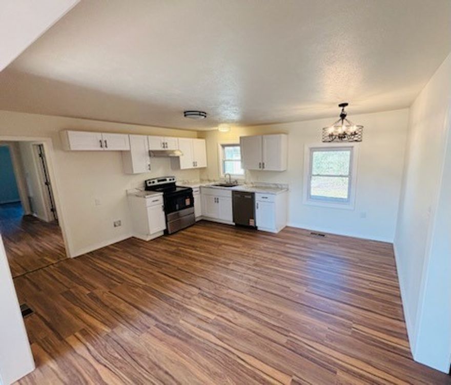 Beautiful 3-bedroom, 1-bath home with an attached carport situated on approximately 8 acres. Around 7 acres are fully fenced pasture, with an additional 1 acre dedicated to the home and yard. The home has been thoughtfully updated, including the kitchen, bathroom, laundry room, new flooring throughout, and new interior doors. A bonus room offers flexible space for an office, hobby room, or additional living area. Enjoy a quiet country setting with a great spot for a garden, all located outside the city limits. Peaceful rural living while still being just approximately 15 minutes from Harrison.