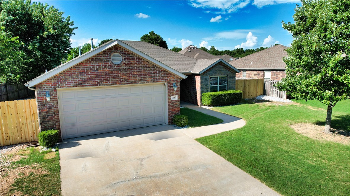 Nestled in a quiet, established neighborhood, this all-brick home offers both convenience and comfort. Ideally located near top-rated schools, shopping, dining, Mt Hebron Park, Razorback Greenway Trails, JB Hunt HQ and easy access to I-49, this home makes daily living a breeze. The inviting floor plan features a spacious living area with abundant natural light, a cozy fireplace, and easy flow into the kitchen and dining spaces—perfect for gathering with family or friends. The kitchen boasts plenty of granite countertops & maple cabinetry. The primary suite offers a private retreat with a remodeled en-suite bath and walk-in closet, while additional bedrooms provide versatility for family, guests, or a home office. Enjoy the peaceful backyard, ideal for relaxing or entertaining or the covered porch - the mature trees that add privacy and charm. With its prime location and welcoming design, this home is move-in ready and waiting for its next chapter. Ask for Feature Sheet for additional features and upgrades