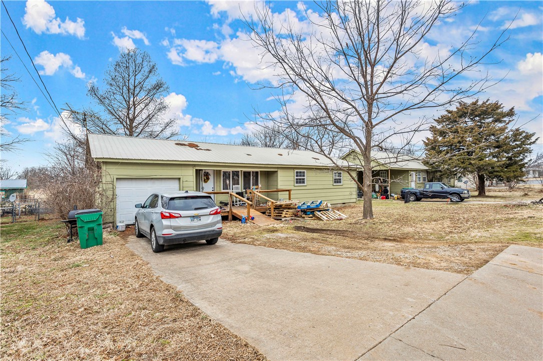 Knock, Knock... Prime investment opportunity is knocking on your door! 3 homes (1476 SQ FT, 1212 SQ FT & 996 SQ FT) sitting on almost 4 flat acres in the Opportunity Zone in Springdale that is currently zoned I-2 has endless possibilities! 2 homes have been recently updated, all 3 can be leased & bring cash flow each month. Looking to develop? You won't find a better piece of land surrounded by all types of mixed use--you dream it you can do it here! Split it up and build it out--you can do that too! Don't be left behind because this one will move quick! Also listed as MLS: 1208759