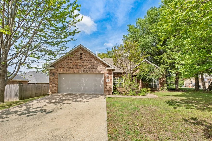 Location, location, location. Welcome home! This charming 3-bedroom, 2-bath residence is nestled in one of Fayetteville's most desirable locations, near Fayetteville schools, Holcomb Elementary, the University of Arkansas, and just 2 minutes from I-49. If you're looking for convenience and comfort, this home has it all. Inside, you'll find a spacious open concept layout connecting the living, entry, and dining areas, ideal for both everyday living and entertaining. The kitchen is well-equipped with stainless steel appliances, granite countertops, a bar, and breakfast nook that opens into a cozy living room complete with a fireplace.  Storage abounds with a large garage, ample closets, and attic access. Don’t miss this opportunity to own a beautiful home in a prime location!