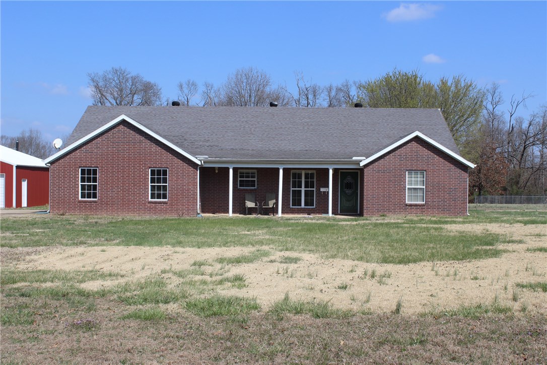 Country living but minutes from downtown Rogers. Almost 4 level acres of land to play on. 24 x 30, 3 bay shop is a huge bonus for those who need extra storage of love to work on projects. Split floor plan and wood burning fireplace.