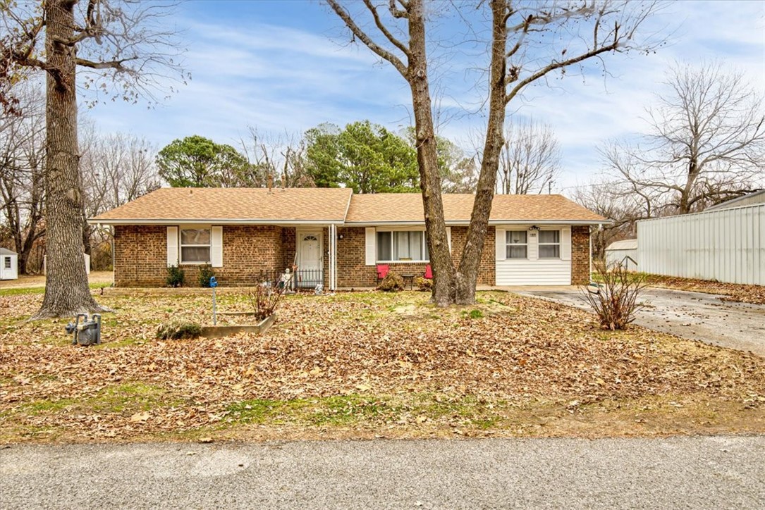Includes an adjacent .49-acre lot, that is a separate parcel. Easy access to I-49, presents an exceptional investment opportunity. The house is also on a .49-acre lot. This is a well-kept 4 bedroom, 2 bath, 1857sf house. The backyard is fenced. Updates include a new roof in 2019 and newer tile floors. Please contact the agent to schedule a showing now!
