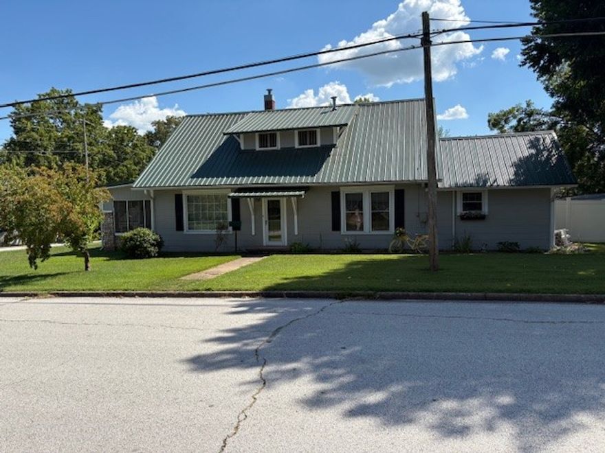Step into timeless charm with this lovingly maintained early 1900's home! The current owners have lived there for 38 years, and have kept it immaculate and well maintained.  It has 4 spacious bedrooms and 1 1/2 baths, is filled with natural light through abundant windows, and has beautiful hardwood floors. The large living room is highlighted by a cozy gas log fireplace and elegant glass french doors leading to a main level bedroom, and you will love the large screened porch! The eat-in kitchen is generous in size, complemented by a large dining room perfect for gatherings. Upstairs, discover a private suite with a bedroom and roomy sitting area. Additional features include a full basement and a large, level lot enclosed by a 7' vinyl privacy fence-ideal for entertaining and outdoor living. A perfect blend of classic character and comfortable modern living.