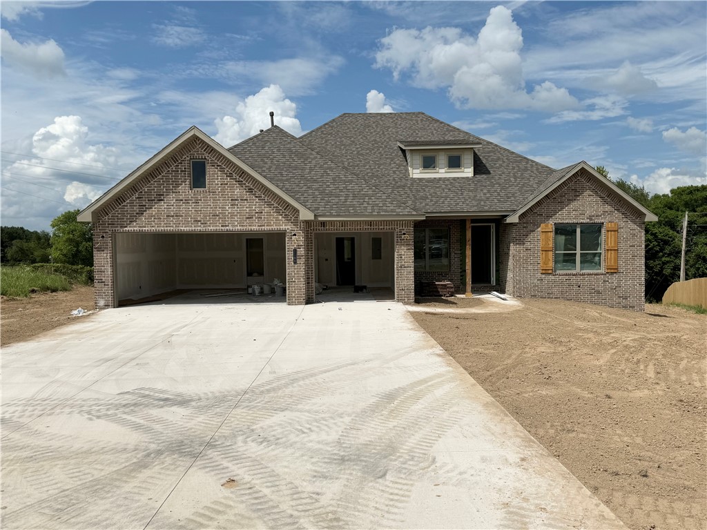 Welcome to Arlington Subdivision, where a delightful community pool is the heart of this neighborhood, fostering friendships and offering a refreshing escape. The Charming town of Pea Ridge, is a haven for nature lovers, with outdoor activities like hiking and fishing.Introducing the 2647 Plan: a newly constructed 4-bed, 3-bath residence. The living area's focal point is a ventless gas log fireplace, creating a cozy ambiance. The kitchen features stainless steel appliances, vented hood, custom cabinets, and a corner pantry. Tiled-to-ceiling baths showcase practical quality. Standard amenities include a gas water heater, custom trim, wood privacy fence, gutters, and a gas grill hook-up on the covered back patio for convenience and entertainment. Whether on the back patio or in the formal dining area, the 2647 Plan offers top-notch craftsmanship and contemporary living. Welcome home to a blend of style, functionality, and energy efficiency.