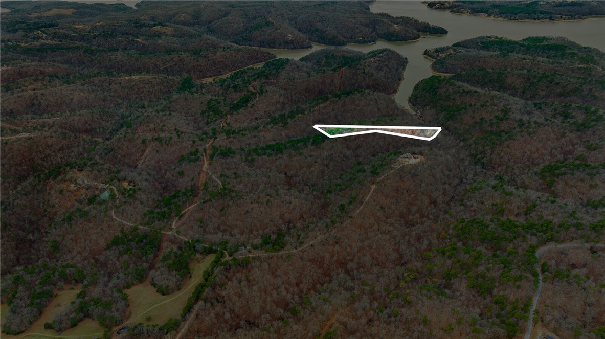 Discover the perfect canvas for your dream home with this stunning 5-acre tract in Emerald Bay subdivision. Boasting breathtaking views and endless potential, this property offers a serene retreat near the lake. While well water and septic are needed, electricity is already on-site, making your building process more convenient.
Located just minutes from the historic War Eagle Mill and a short drive to downtown Rogers, youāll enjoy the perfect balance of peaceful living and easy access to amenities. Whether youāre envisioning a custom home or a weekend getaway, this property provides the ideal setting to bring your vision to life. Donāt miss this rare opportunity to own a slice of Emerald Bay!