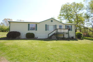 This spacious double-wide, featuring an open floor plan, sits on over an acre of manicured lawn. This home has plenty of space for the kids to spread out to do their homework ---and for family time together. When it's time to relax after a long day, escape to the master bathroom and enjoy your jetted tub! Also on the property are a 3-car carport and your own apple orchard! An outdoor water source helps keep your garden watered even during the hottest summers. From the time you open the front door, you'll be pleasantly surprised at the amenities this home offers! Call today for a showing appointment! (The property currently has a tenant)
