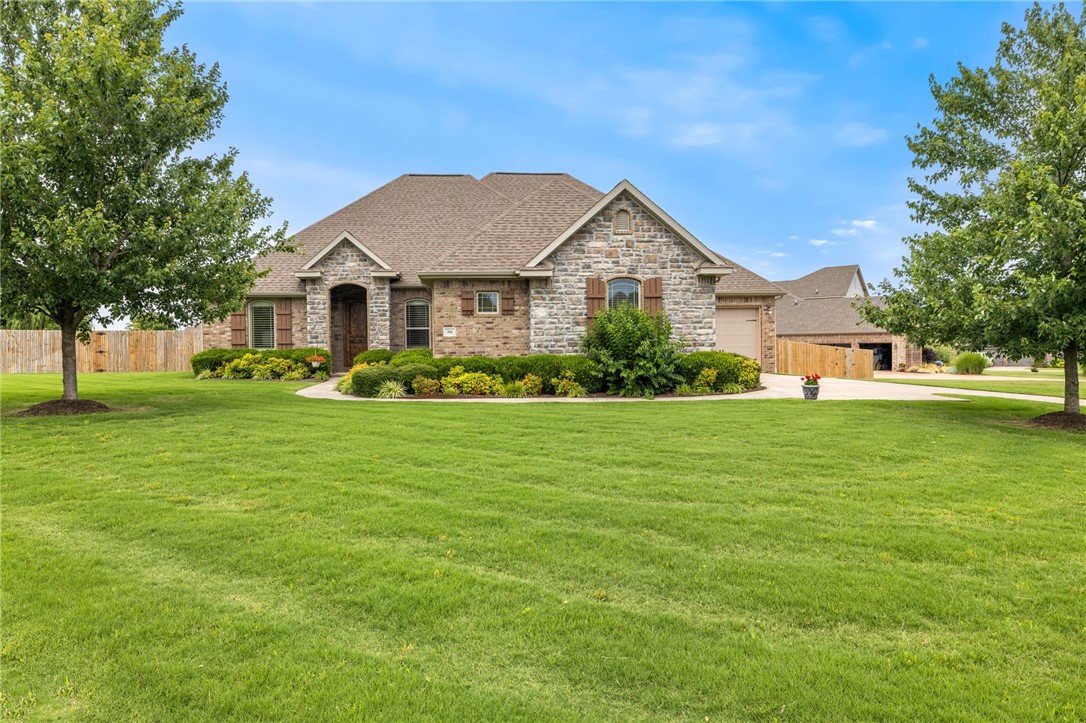 Beautiful 4 Bedroom Home in Twin Falls Subdivision – Farmington, AR..... Welcome to this spacious 4-Bedroom, 2.5-Bath home on just under an Acre in the desirable Twin Falls subdivision! Featuring stunning architecture and thoughtful details throughout, this 2,733 SF home offers both style and comfort, perfect for making lasting memories. The chef's kitchen is a standout with abundant granite counter space, a center island, gas cooktop, double ovens, and a walk-in pantry. The split floor plan provides privacy with a grand primary suite on one side and a Jack-and-Jill bath connecting the other two bedrooms on the opposite side. Enjoy the natural light in the living room with its soaring ceilings and beautiful stacked rock fireplace. A versatile hobby/sunroom overlooking the backyard also features its own stacked rock fireplace—ideal for relaxation or creative pursuits. The fully landscaped front yard includes a sprinkler system, completing the picture of this well-maintained and move-in-ready home.