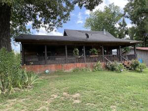 Country style cabin home on 17.9 acres with brand new pond. Outside features a covered front and back porch, a creek on the property and close to the National Forest and East Mt. Zion community. Also included is a horse barn, with fencing, chicken coup with fencing, and cleared bulldozed area. Inside features a 3 bedrooms 1 bath with a whirlpool tub and shower. Open concept kitchen, dining, and living room area. Propane, septic, city water, and electric.