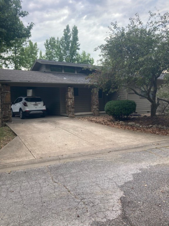 This charming 2 bedroom 2 bath townhouse has been fully renovated!! The open floor plan allows easy flow between living room with electric fireplace, dining area, and kitchen. The kitchen is equipped with all new stainless appliances. Large master bedroom with on suite, spacious 2nd bedroom, both with ample storage. Prime location on Holiday Island with walking distance from community pool, recreation activities and golf. Huge deck off the back and covered carport with 2 storage areas. Lawncare is included.