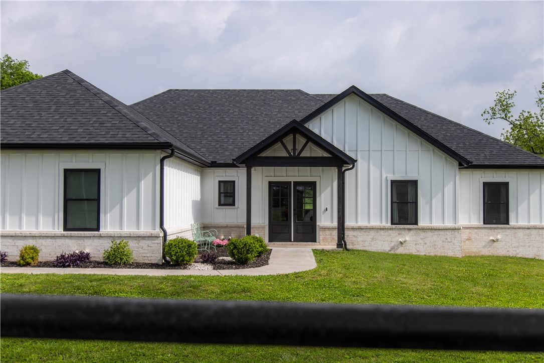 Contemporary exterior featuring white vertical sid