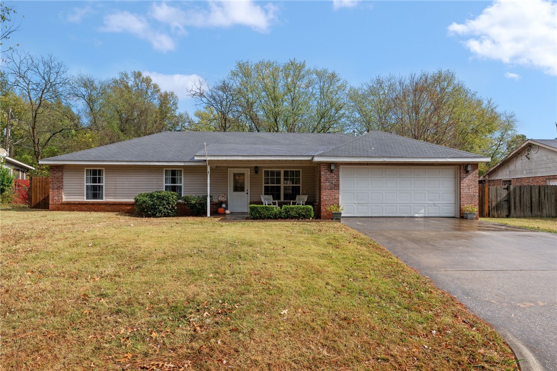 Discover this well-maintained 3-bed, 2-bath home, less than 10 minutes to the U of A and all that Downtown Fayetteville has to offer. With thoughtful upgrades throughout! Step inside to an open floorpan with vaulted ceilings in the family room. Kitchen has been modernized with a 2024 dishwasher and refrigerator (both convey) along with a new sink, faucet, and garbage disposal for convenience. Ceramic wood-like tile flooring extends through the entire home, adding durability and style. A luxury like primary suite and bathroom including, double shower heads, a handheld shower wand, and brand-new shower doors (2024). A fully fenced backyard with a covered patio perfect for relaxing or entertaining with ample space for pets. Additionally, a new WiFi-enabled garage door opener will convey with MyQ app compatibility enhances security and accessibility. Washer and dryer do not convey. Sold as-is, this home is ready to welcome new owners to enjoy its many features with the option to add your own personal touch!