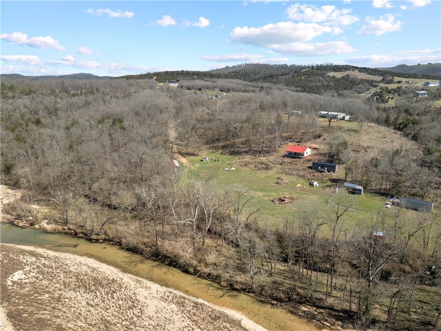 Looking for a place you can truly make your own? This one’s all about potential.

Situated on 3 acres overlooking beautiful Bear Creek, this approximately 1,000 sq ft structure is ready for your vision to take over. The bones are in place—giving you a head start without locking you into someone else’s design choices.

The space is currently unfinished and not heated or cooled. Electricity has not yet been brought to the property, though the structure has been partially wired. A shared well is available but has not been connected, and there is no plumbing in place.

This setup makes it an excellent candidate for off-grid living or a self-sufficient lifestyle, giving you the freedom to design your systems exactly how you want them.

Whether you’re dreaming of a weekend getaway or a custom small home, this property gives you the flexibility to build it your way from the ground up.

3 acres. Creek views. A blank canvas ready for your vision.