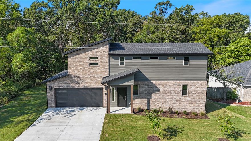 Check out this stylish new construction home located in the Highlands area in Bella Vista! It features two spacious bedrooms with walk-in closets, 2.5 bathrooms, and an open kitchen/dining/living room layout, along with a 2-car garage. Enjoy comfort and style with amenities such as 3 cm granite countertops, LED disk lighting, a Frigidaire Gallery appliance package, and full aluminum guttering. The home is conveniently located near Lake Loch Lomond, bike trails, and is just a short drive from downtown Bentonville!