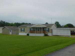 Very clean doublewide mobile located in the Rolling Meadows mobile home park. Home has 3 bedrooms and 2 bathrooms with newer laminate flooring & roof. Included is a 2 car carport & an 18x20 storage building.
