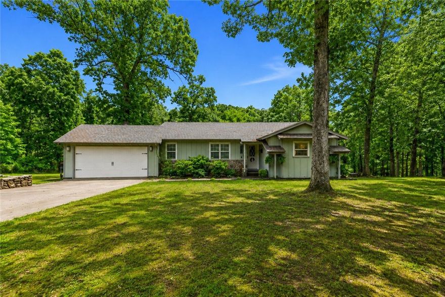 Embrace the perfect balance of peaceful wooded privacy and Northwest Arkansas convenience. This 3 Bedroom, 2 bath, ranch style home spans 1487 square feet of meticulously updated living space. It sits beautifully on a .93 acre lot with many mature trees just outside the Rogers city limits. This property is a rare find for anyone seeking acreage, modern design. and exceptional regional access. 10 mins from downtown Rogers, and 3 minutes from Beaver Lake. New roof in 2024