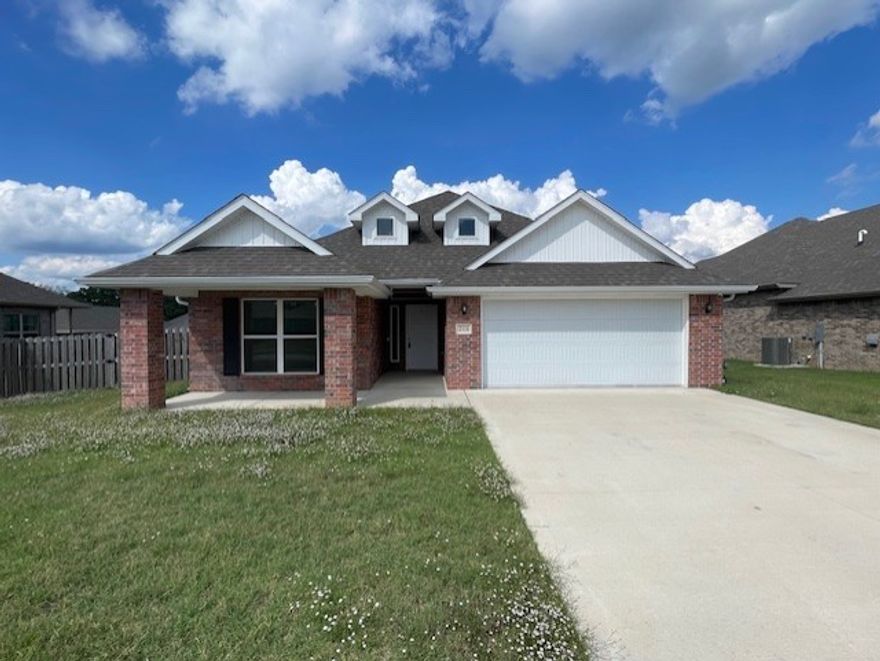 With over 2,000 sq ft of open living space, this inviting 4-bedroom, 2-bath home offers comfort and style for just about any family. Enjoy a spacious living room with a cozy brick fireplace, perfect for relaxing evenings. The kitchen flows seamlessly into the dining area, ideal for entertaining. Step outside to a covered back porch and a fenced-in backyard, great for gatherings, pets, or play. This home blends warmth, functionality, and charm in a location you’ll love.**$250 non-refundable pet deposit **