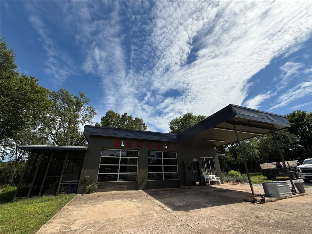 Here is your unique chance to own your own antique, completely remodeled and livable, midcentury Conoco service station! The ultimate loft style artist studio, man cave or live/work space on three acres, you won't find this inexpensive convertible square footage out there right now. Located just 14 miles east of downtown Fayetteville, rent as an airbnb, work on your hobbies or live in while you build your dream house on the 3 acres it sits on!
