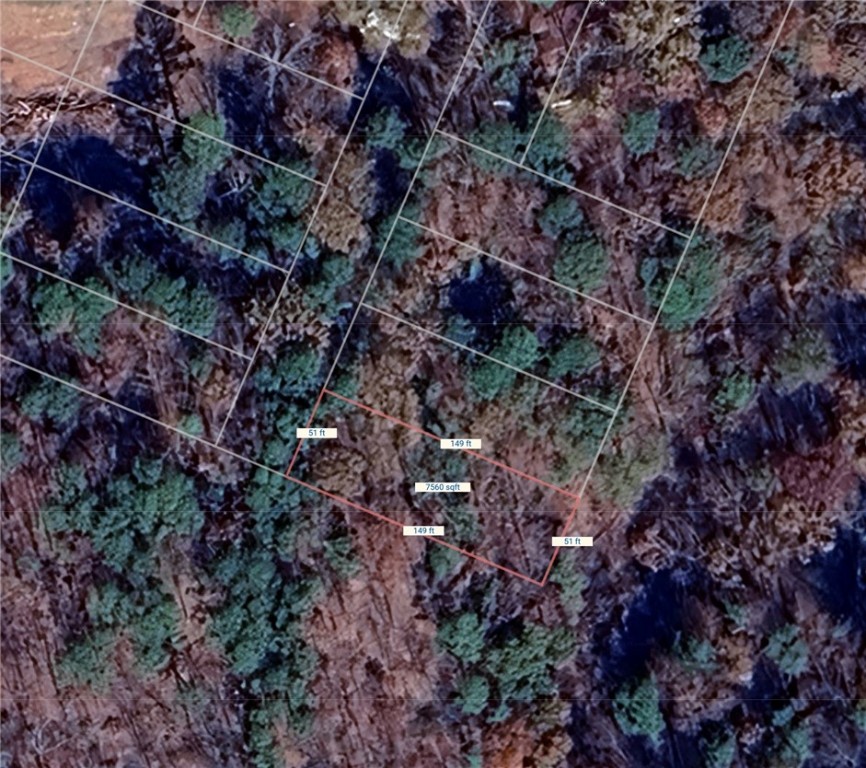 Beaver Lake area lot in the Beaver Shores Subdivision. Very Secluded with a few houses on the street. Prairie Creek Marina and 3 other boat launch ramps located just right around the corner. Minutes to Downtown Rogers. Water and electric at street.