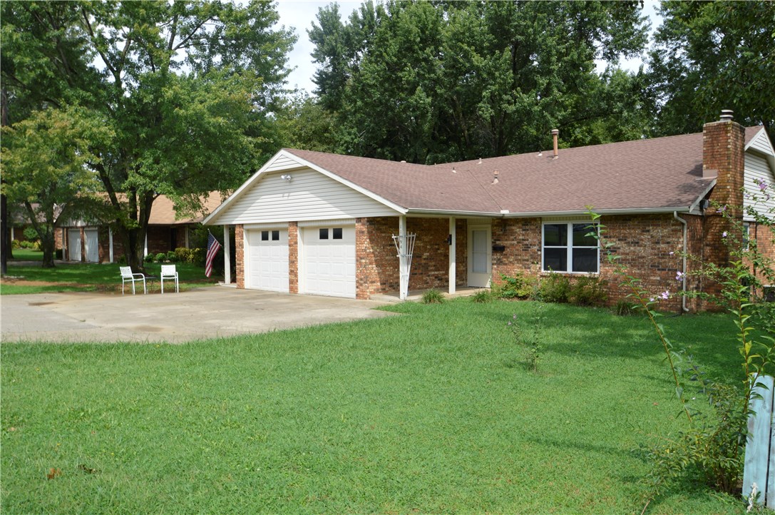 Nice brick duplex ready for owner to live in one side, rent the other. 2 bedroom, 2 bath, 1 car garage each side. Large closets, gas log fireplace. Nice covered patio with extra storage. Nice level lot, convenient location.