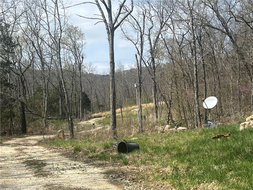 Escape to the heart of the Ozarks with this rare opportunity to own 16.5 acres of secluded paradise near Keys Gap and the stunning Buffalo National River in Jasper, Arkansas. This unique property features a partially completed barndominium-style home, perfect for those looking to customize their dream retreat, vacation rental, or homestead in one of the most scenic areas of the state.

Property Highlights:

16.5 Private Acres – Wooded and gently rolling terrain including spring-fed pond with abundant wildlife, perfect for hunting, hiking, or simply enjoying the peace and quiet.

Framed & Livable Barndominium – The main living area is functional and move-in ready with a finished downstairs. The upstairs is framed for additional bedrooms and plumbed for a future bathroom—ready for your finishing touches.

Year-Round Spring & Water Storage – Reliable water source with a 7,000-gallon storage system, ideal for off-grid or sustainable living.

400 Amp Electric Service – Plenty of power to support your current