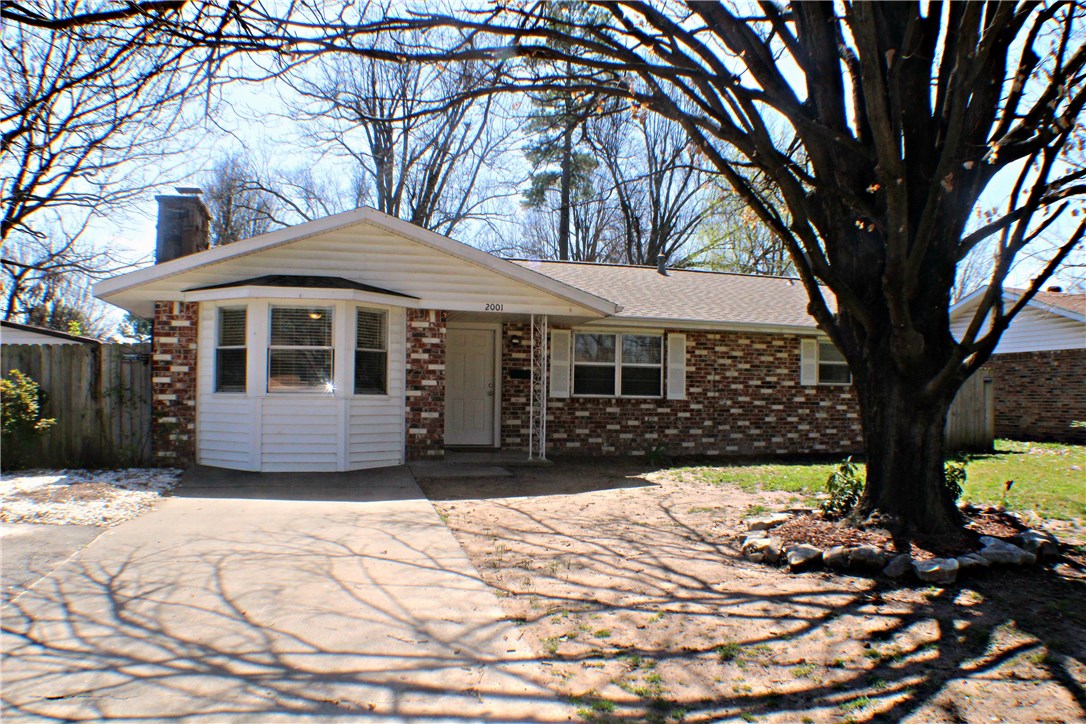 This delightful brick home if ready for your family! 3 bedroom 1 bath with a large family/living room. The ceramic wood-look tile brings a modern feel to this cozy home! Corner lot with a privacy fence. Detached carport/garage.